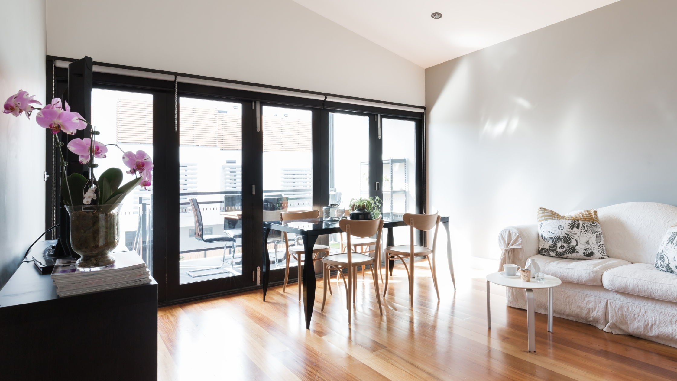 Custom bifold doors opening onto a Bay Area patio