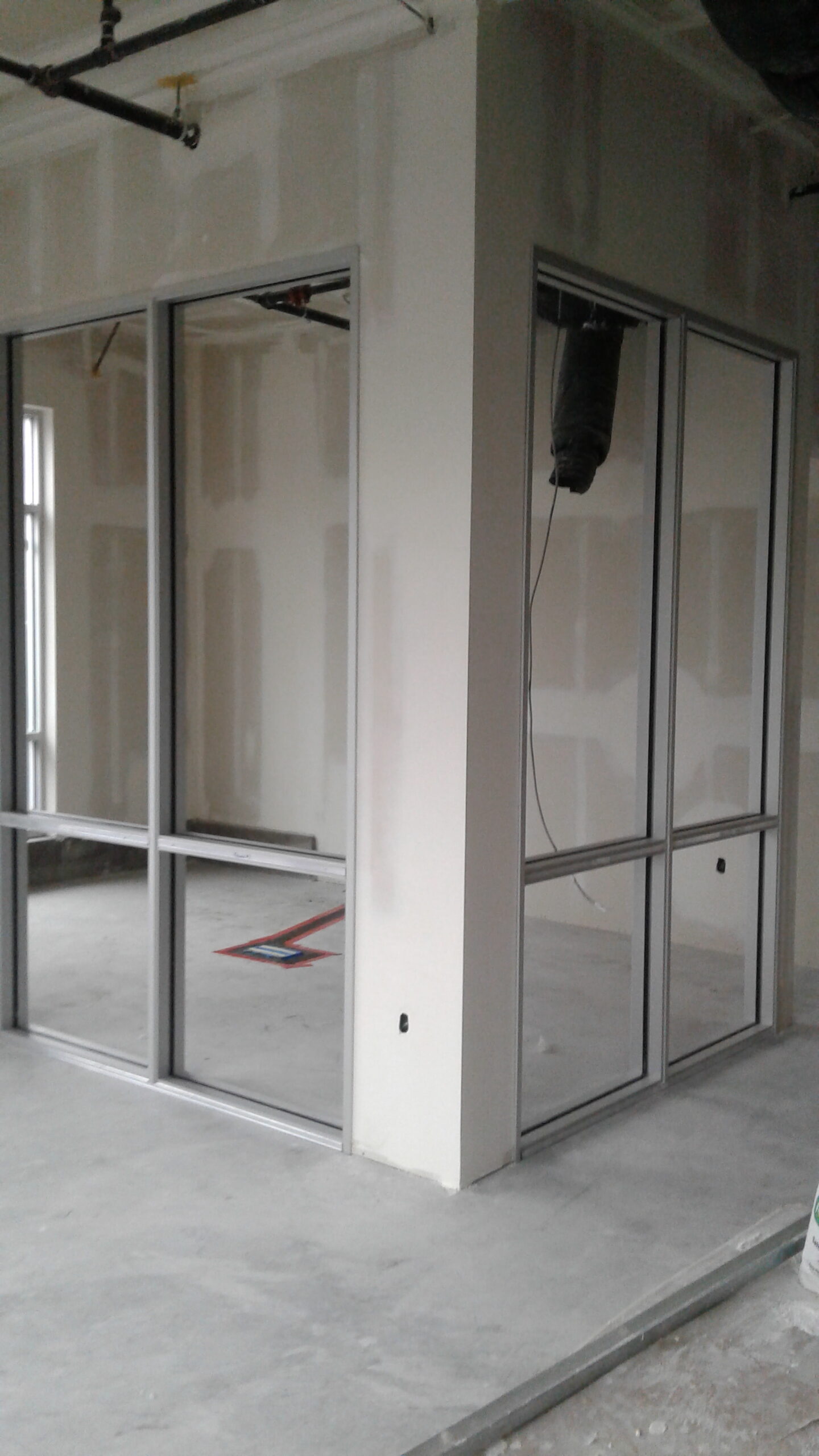 Aluminum interior storefront framing set during commercial build-out