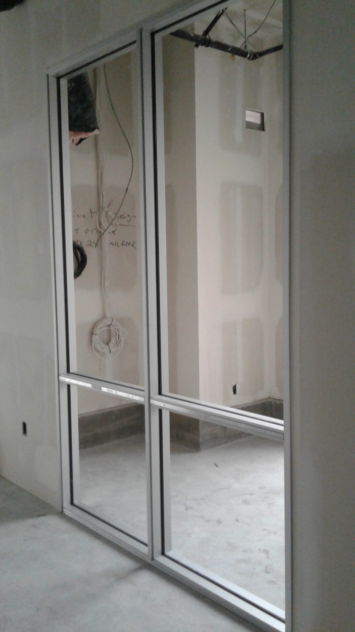 Glazed aluminum storefront frames during commercial tenant improvement